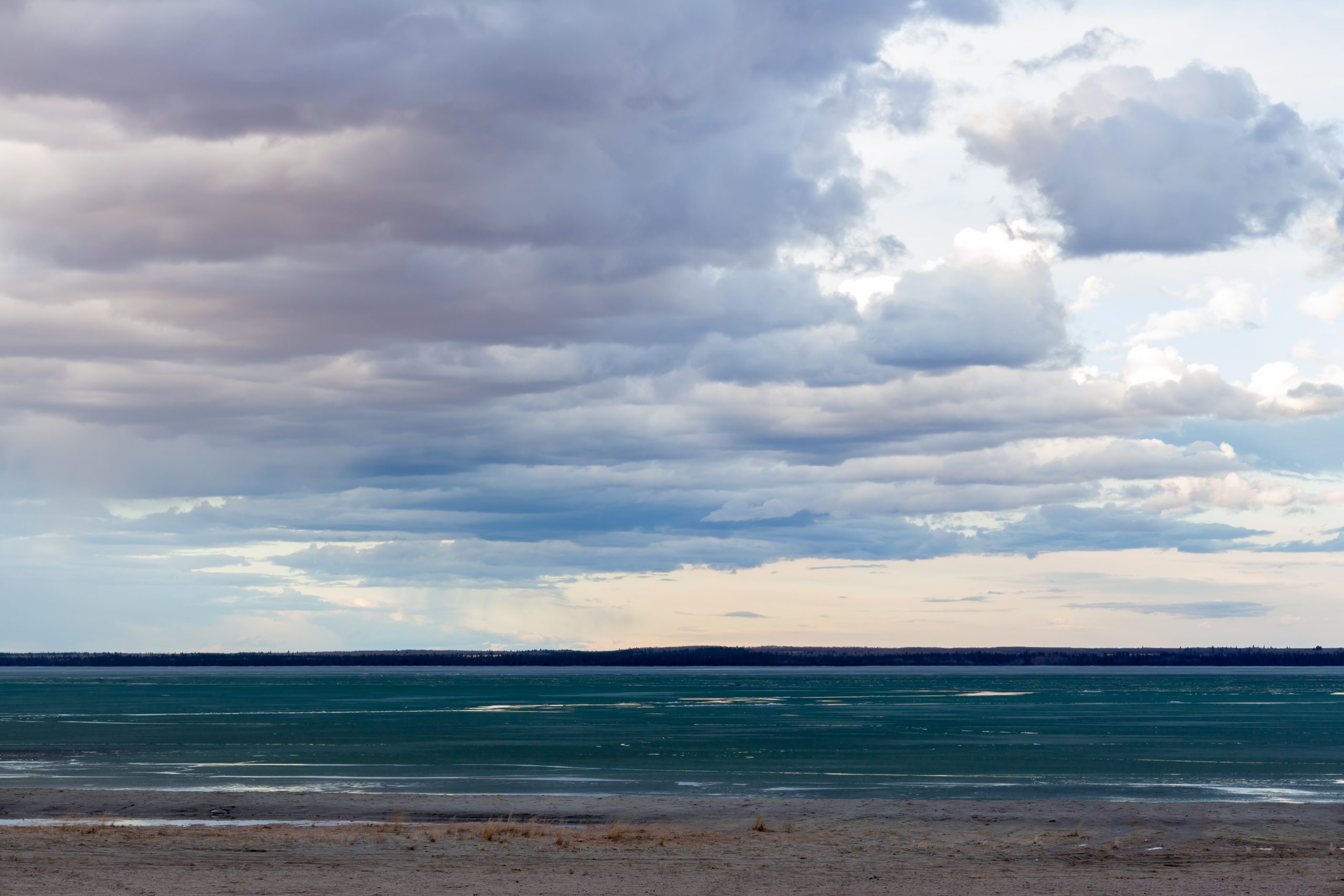Brightsand lake Saskatchewan lake shore line in spring thaw with